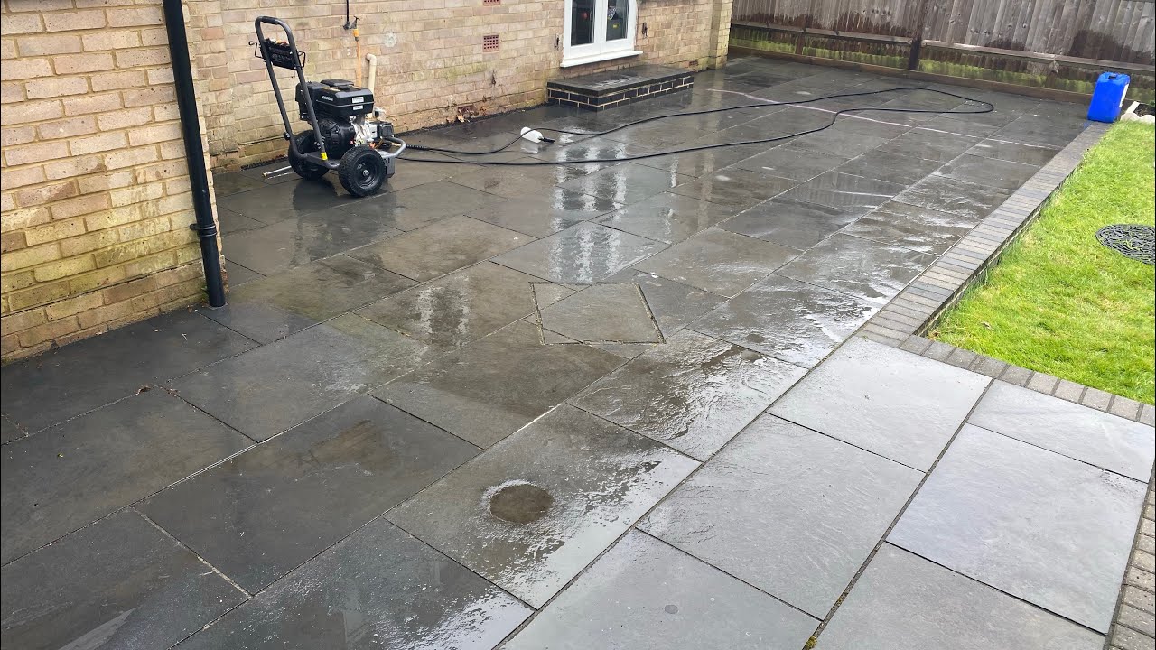 Pressure washing a driveway